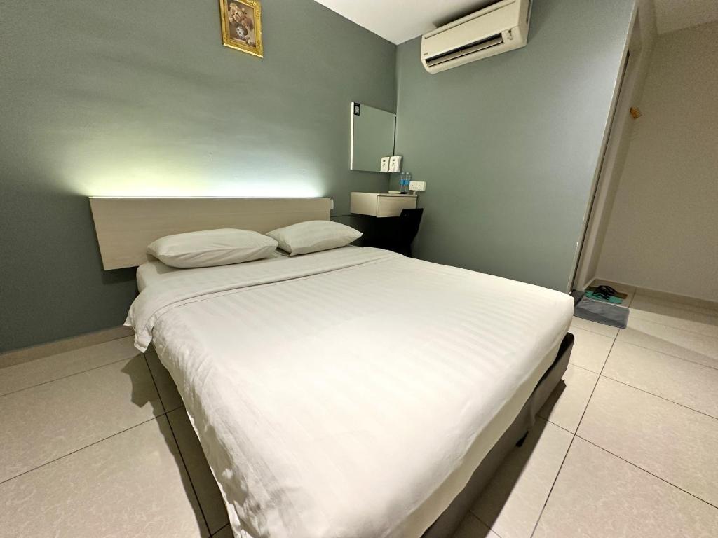 Postel nebo postele na pokoji v ubytování De UPTOWN Hotel @ P.J. 222