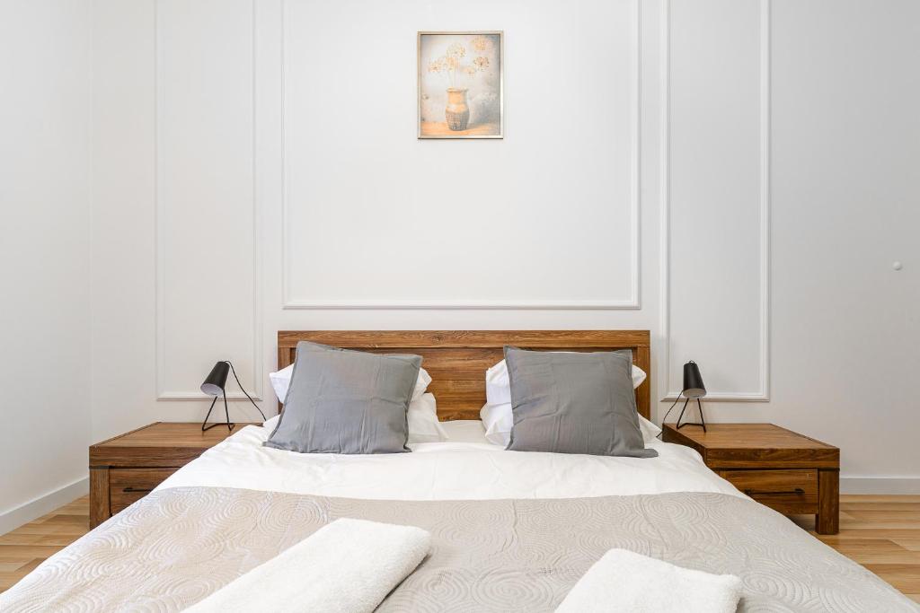 Posteľ alebo postele v izbe v ubytovaní 19 Dzielnica Kolejowa P&O Serviced Apartments