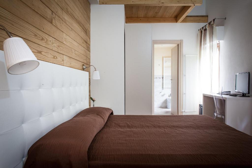 Postel nebo postele na pokoji v ubytování Piccolo Hotel Aurora