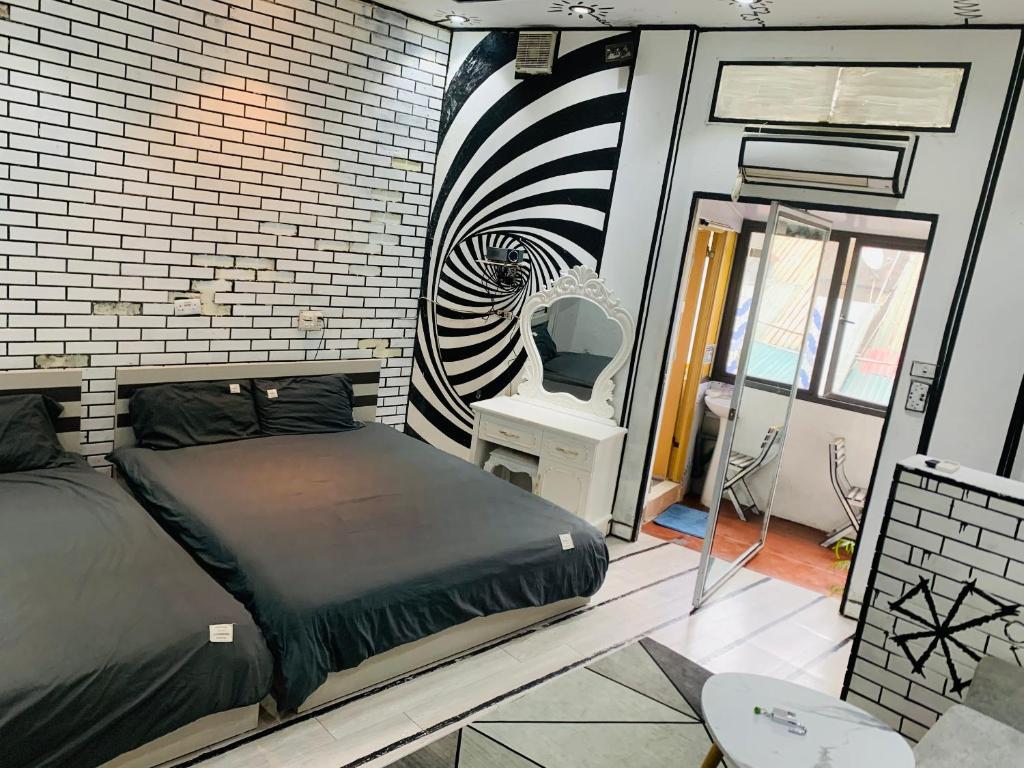a bedroom with a bed and a zebra print on the wall at Heart of Quarter Twin room, Balcony, Projector in Hanoi