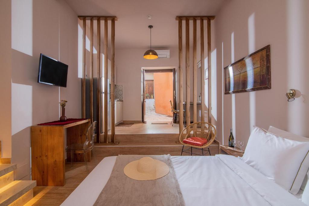 Postel nebo postele na pokoji v ubytování CARPE DIEM HOTEL