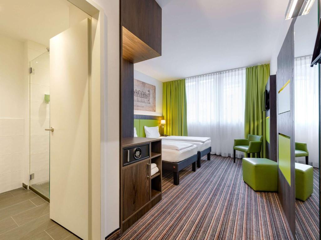 Postel nebo postele na pokoji v ubytování Ibis Styles Trier