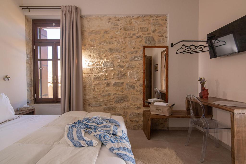 Postel nebo postele na pokoji v ubytování CARPE DIEM HOTEL