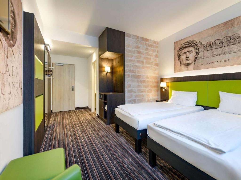 Postel nebo postele na pokoji v ubytování Ibis Styles Trier