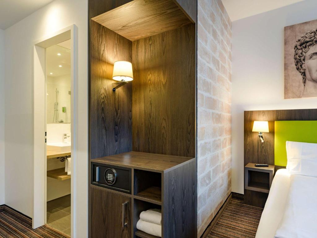 Postel nebo postele na pokoji v ubytování Ibis Styles Trier