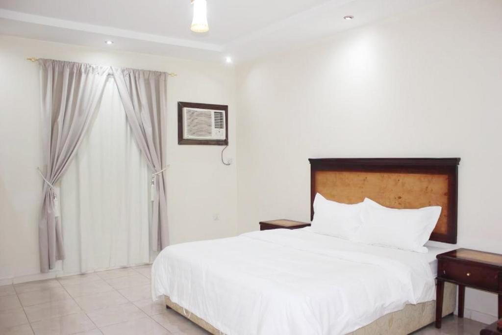 Postel nebo postele na pokoji v ubytování تميز الحمدانية للوحدات السكنية - Tamiz Al Hamdaniya Residential Units
