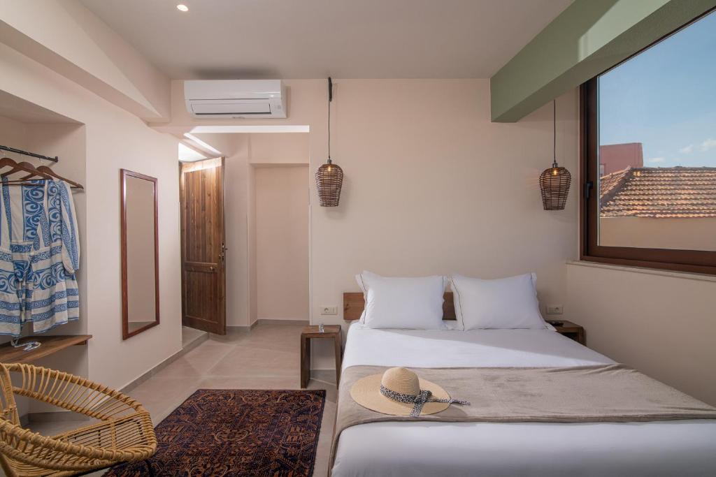 Postel nebo postele na pokoji v ubytování CARPE DIEM HOTEL