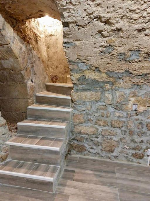 a stone wall and stairs in a building at T2 Atypique en centre-ville in Aix-en-Provence