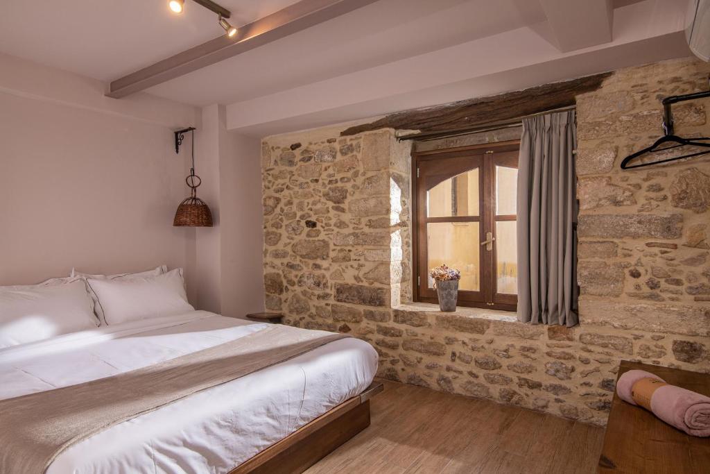 Postel nebo postele na pokoji v ubytování CARPE DIEM HOTEL