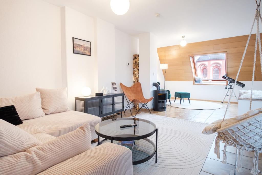 Posezení v ubytování NEU Deluxe Suite Münsterblick, Maisonette, Kingsize Bett, Küche, Netflix, Aussicht, E-Kamin