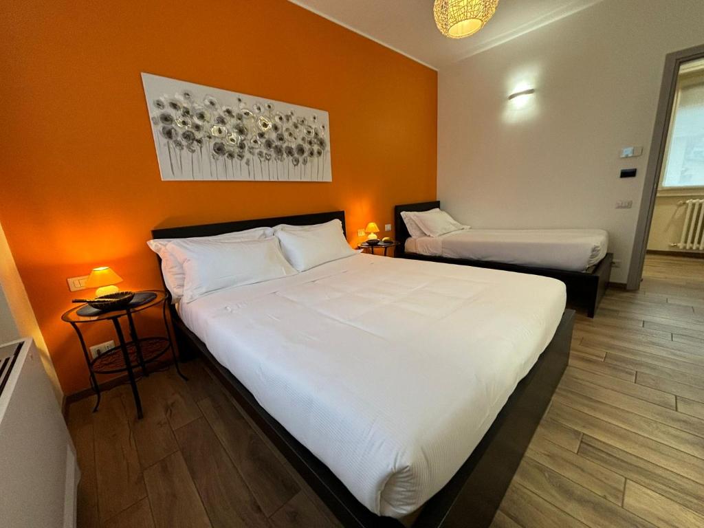 Postel nebo postele na pokoji v ubytování Airuno Rooms