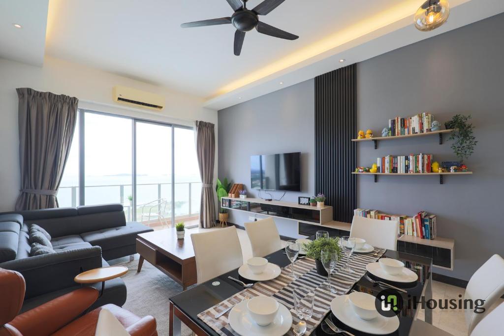 a living room with a couch and a table at Silverscape Deluxe Melaka by I Housing in Melaka