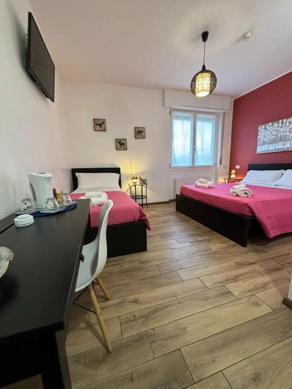 Postel nebo postele na pokoji v ubytování Airuno Rooms