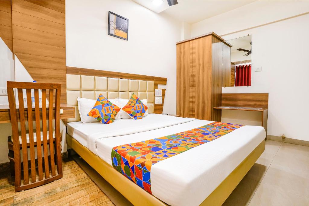 a bedroom with a large bed in a room at FabHotel Candor Amigo in Navi Mumbai