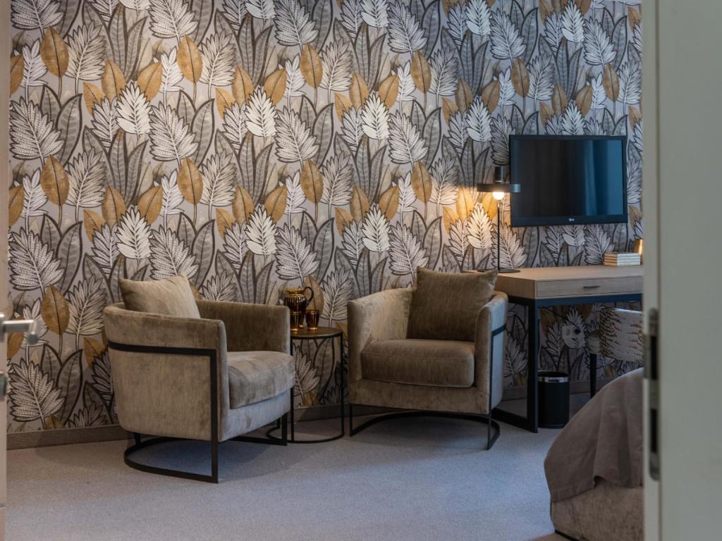 TV a/nebo společenská místnost v ubytování Hotel Forstinger - Boutique Hotel Schärding
