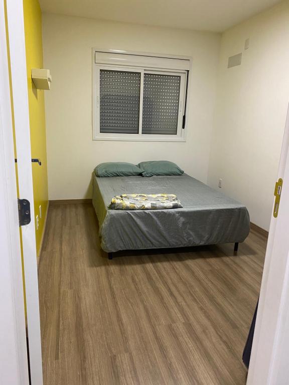 Un pat sau paturi într-o cameră la Apartamento acqua