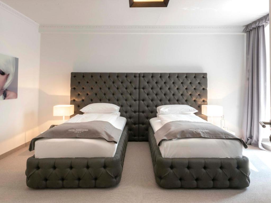 Postel nebo postele na pokoji v ubytování Hotel Forstinger - Boutique Hotel Schärding