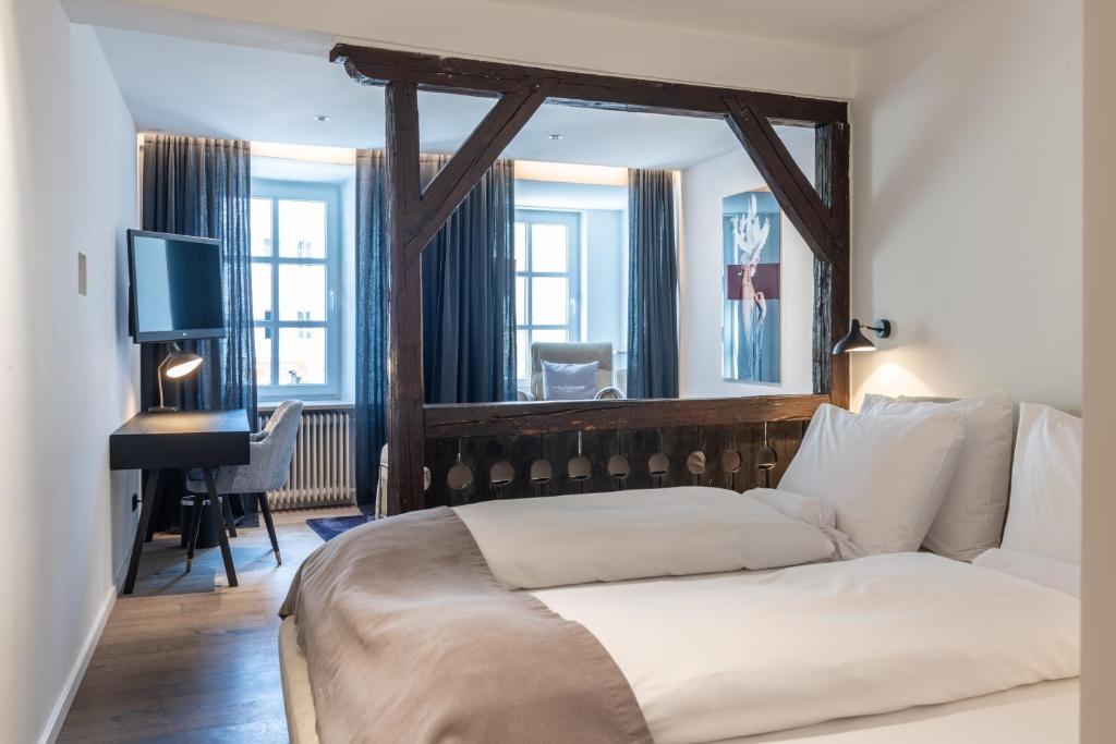 Postel nebo postele na pokoji v ubytování Hotel Forstinger - Boutique Hotel Schärding