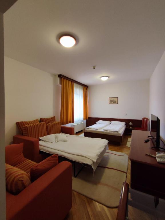Postel nebo postele na pokoji v ubytování Hotel M3