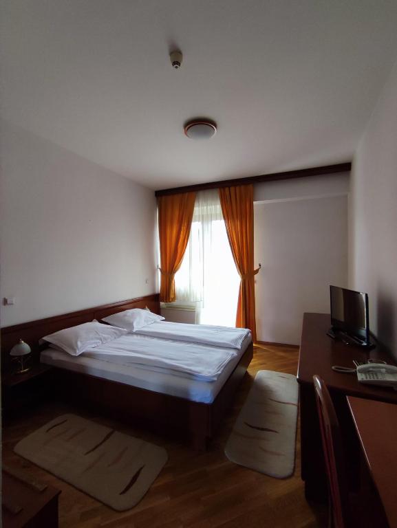 Postel nebo postele na pokoji v ubytování Hotel M3