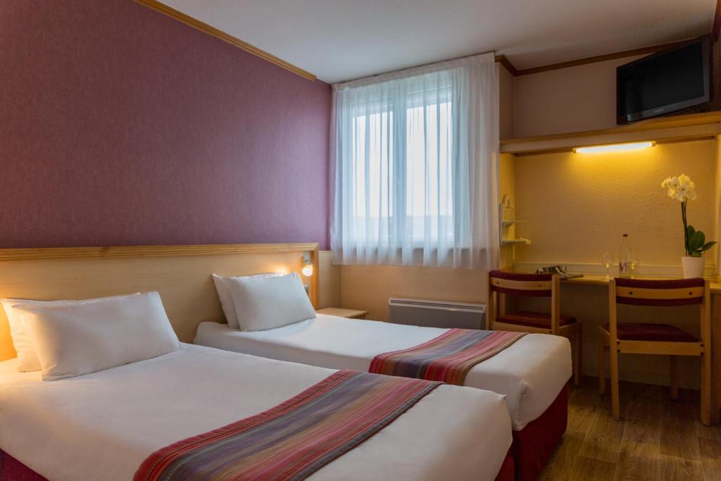 Postel nebo postele na pokoji v ubytování Hôtel Originals City, Armony Dijon - Chenôve