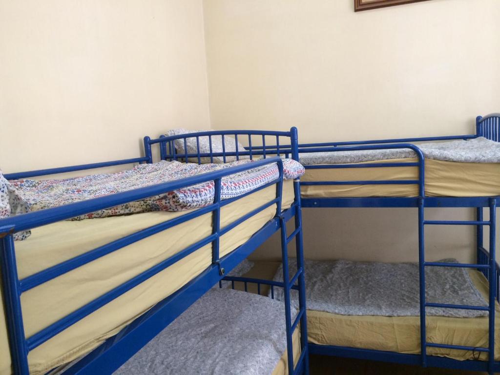 a room with two bunk beds in a room at The Apache Hostel in Dublin
