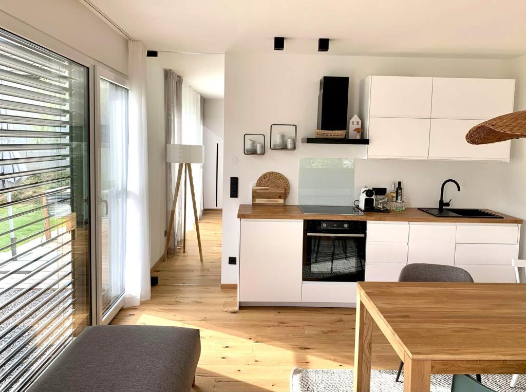 Kuchyň nebo kuchyňský kout v ubytování Logis 11 Apartments