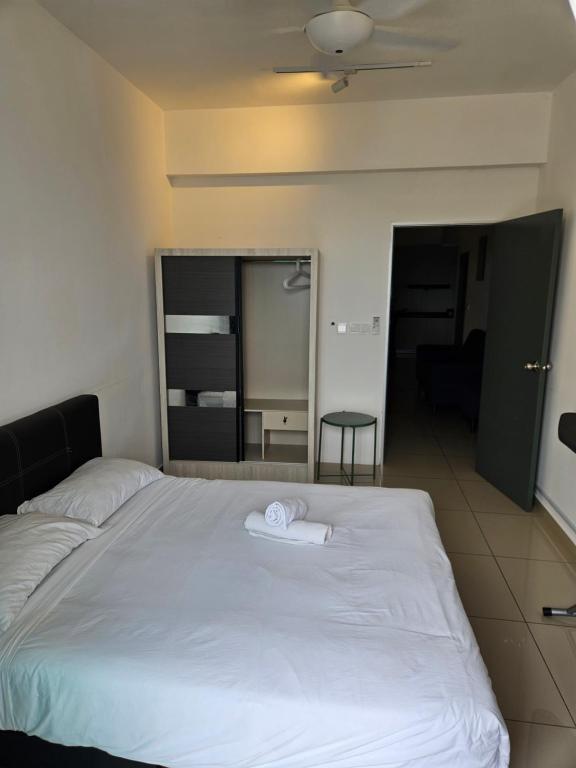 Postel nebo postele na pokoji v ubytování Metropol Serviced Apartment Bukit Mertajam Perda