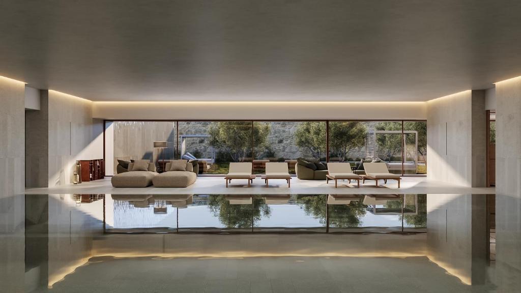a living room with a pool in the middle of the room at The Lince Santa Clara in Vila do Conde