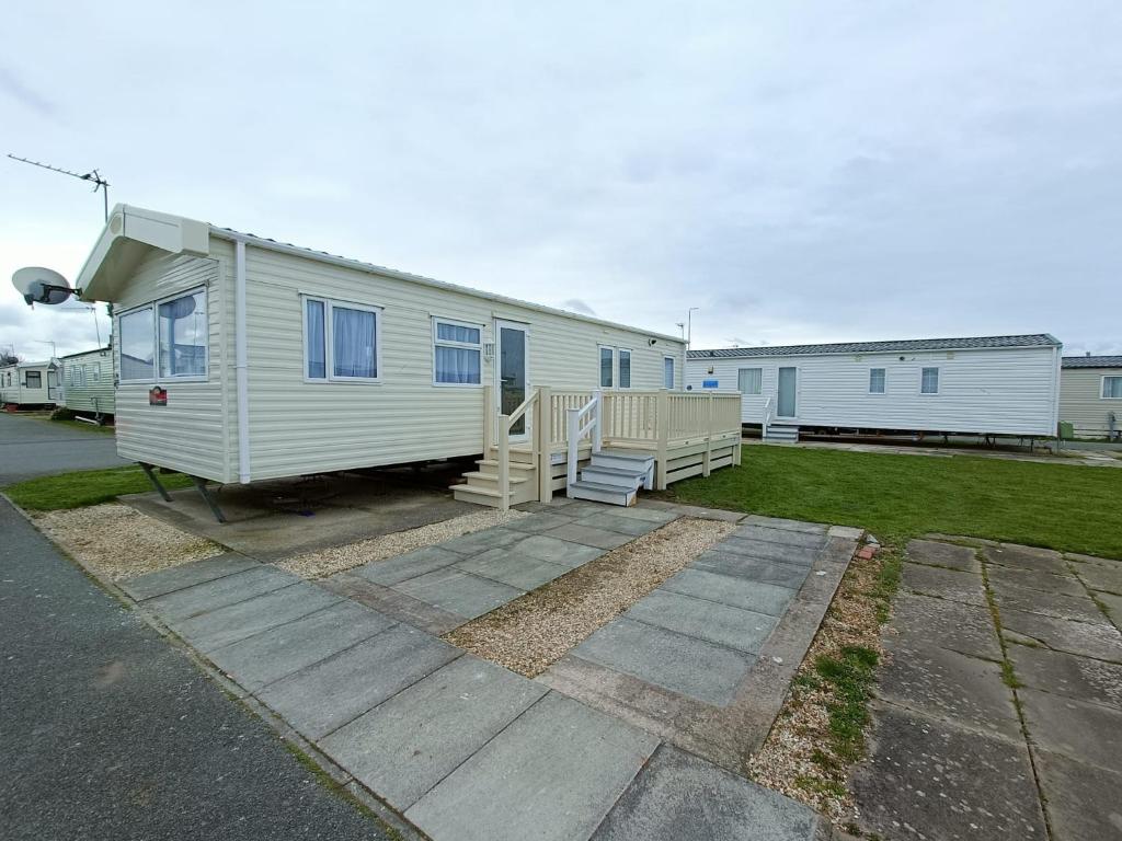 a mobile home is parked in a parking lot at Laurel 20 holidayhome in Rhyl
