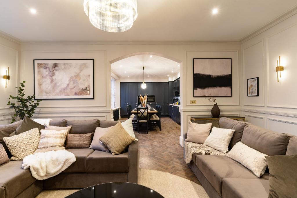 a living room with a couch and a table at Calming Crescent in Buxton