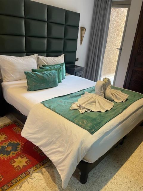 Postel nebo postele na pokoji v ubytování Hotel La Perle du Sud