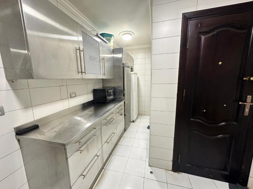 Kuchyň nebo kuchyňský kout v ubytování Pharaohs Rooms