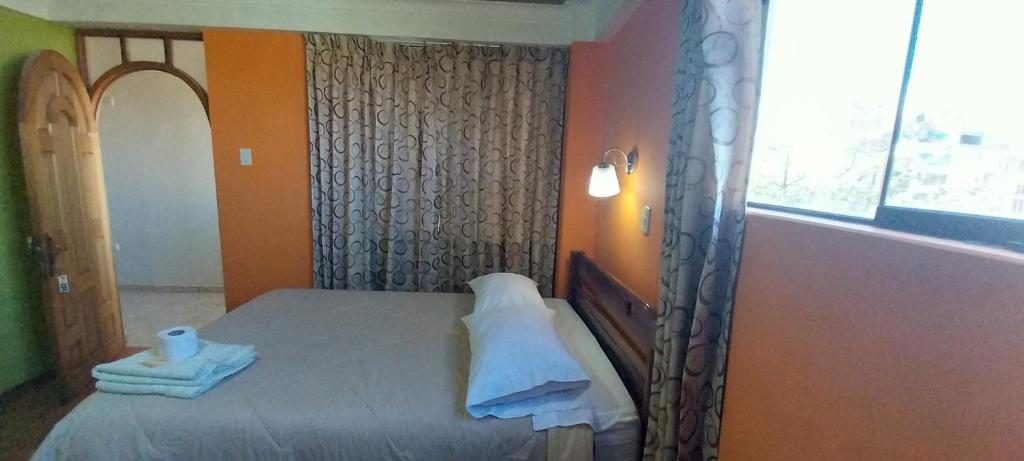 Postel nebo postele na pokoji v ubytování HOSTAL JOYA ANDINA