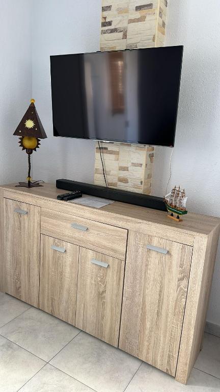 A television and/or entertainment centre at Apartment Santana -19 at Beach with Pool, Garage and Lift