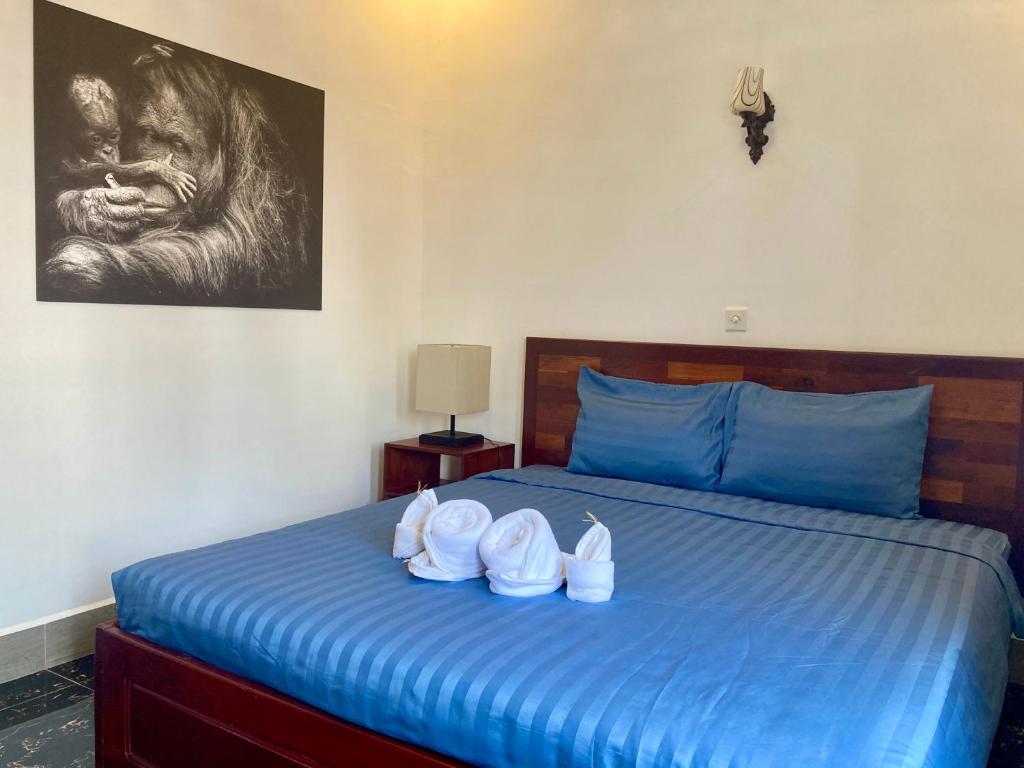 Postel nebo postele na pokoji v ubytování Lotus Haven Villa