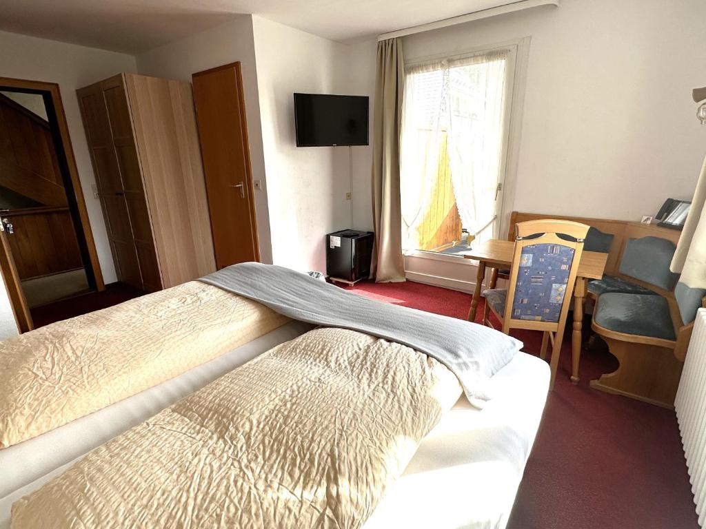 Postel nebo postele na pokoji v ubytování Hotel Zartenbach