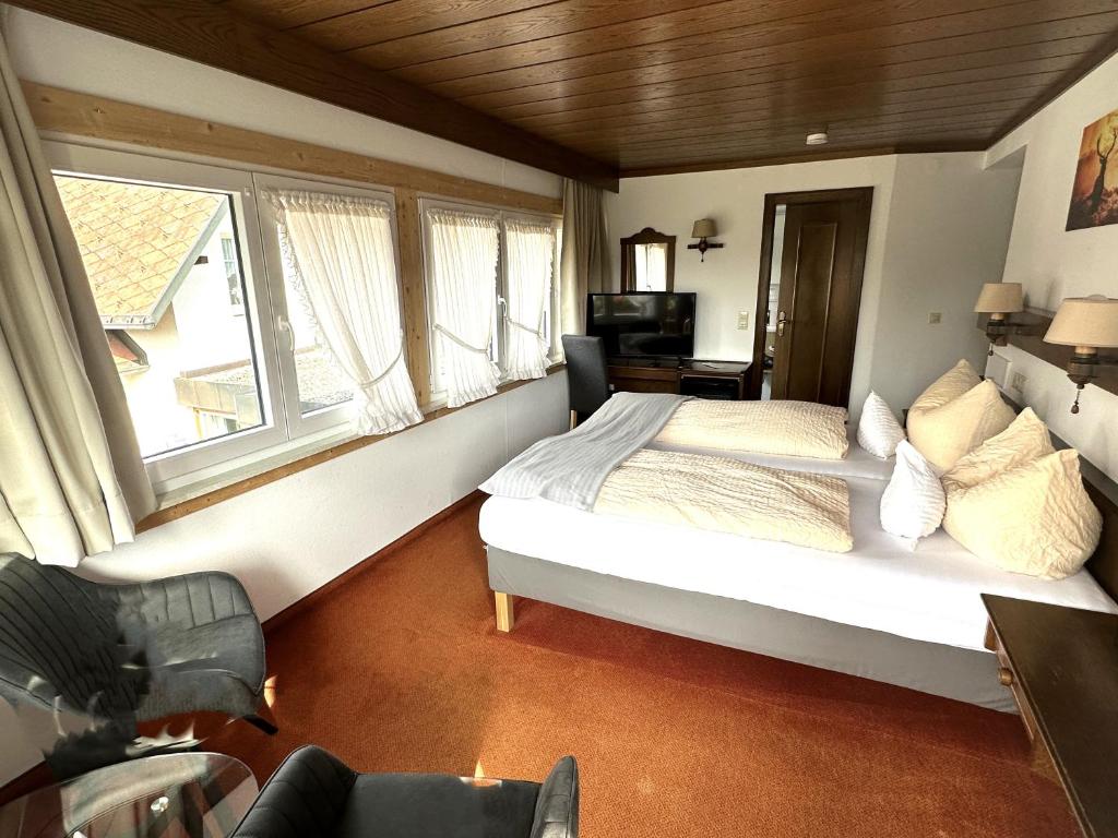 Postel nebo postele na pokoji v ubytování Hotel Zartenbach