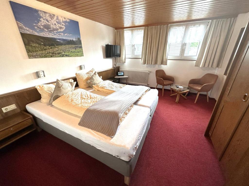 Postel nebo postele na pokoji v ubytování Hotel Zartenbach