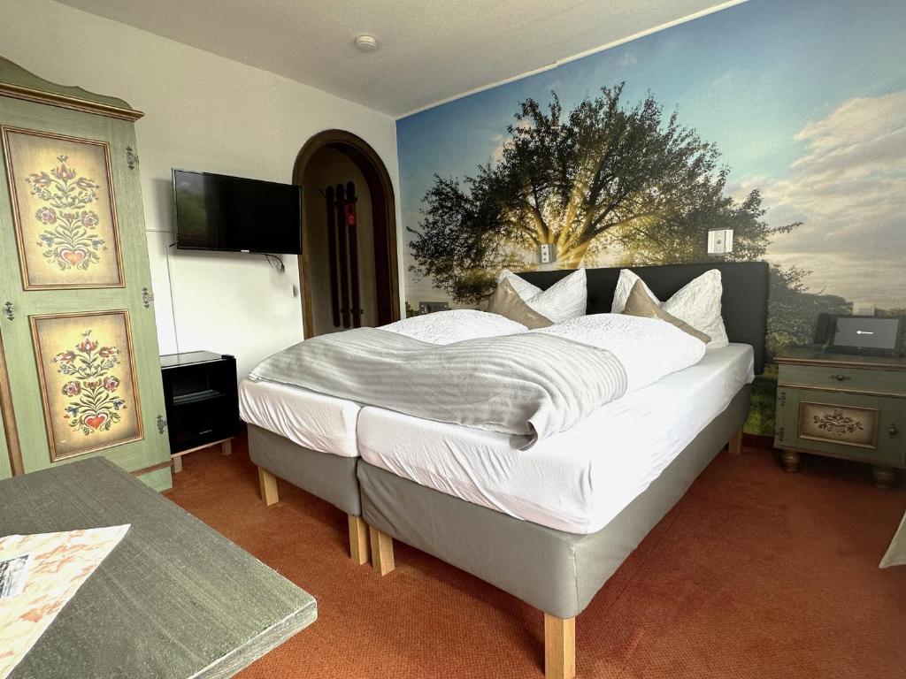 Postel nebo postele na pokoji v ubytování Hotel Zartenbach