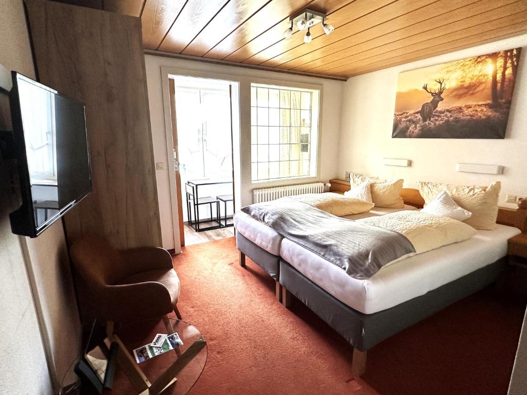 Postel nebo postele na pokoji v ubytování Hotel Zartenbach