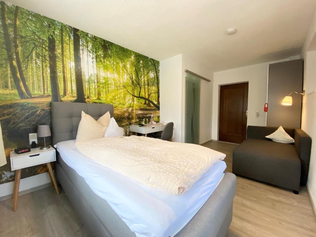 Postel nebo postele na pokoji v ubytování Hotel Zartenbach