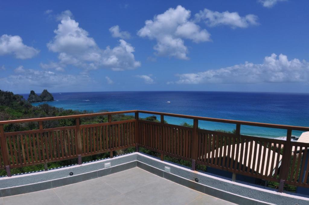 a balcony with a view of the ocean at Pousada Divino Morro in Fernando de Noronha