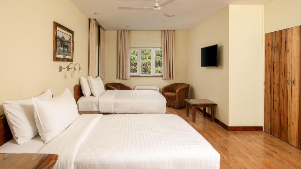 Postel nebo postele na pokoji v ubytování Fairview Hotel Nairobi