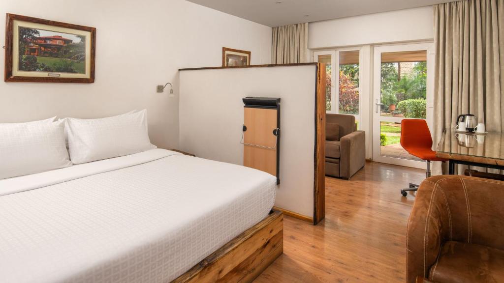 Postel nebo postele na pokoji v ubytování Fairview Hotel Nairobi