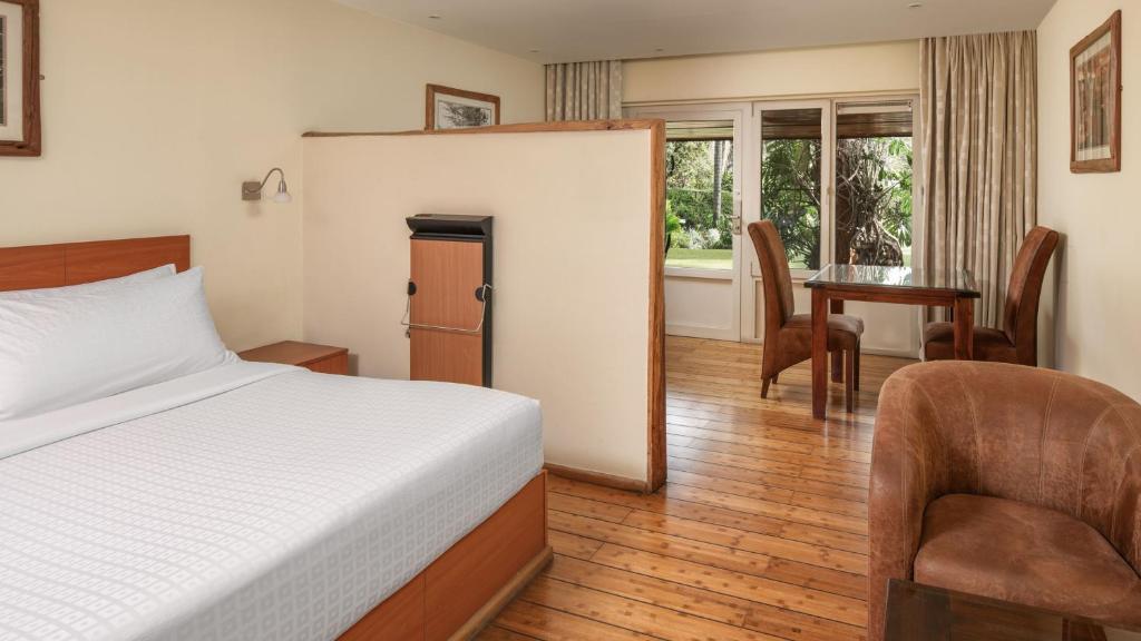 Postel nebo postele na pokoji v ubytování Fairview Hotel Nairobi