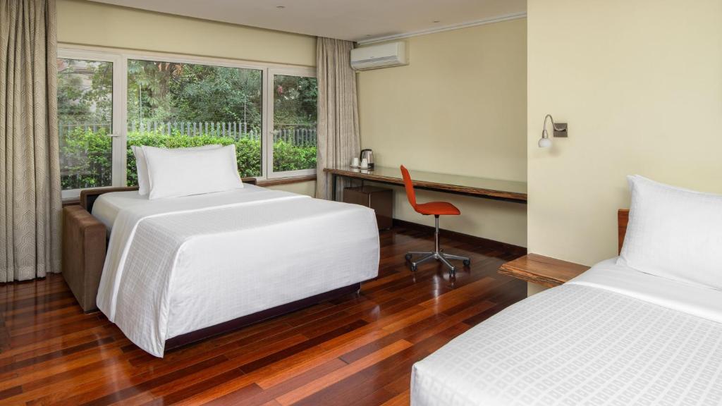 Postel nebo postele na pokoji v ubytování Fairview Hotel Nairobi
