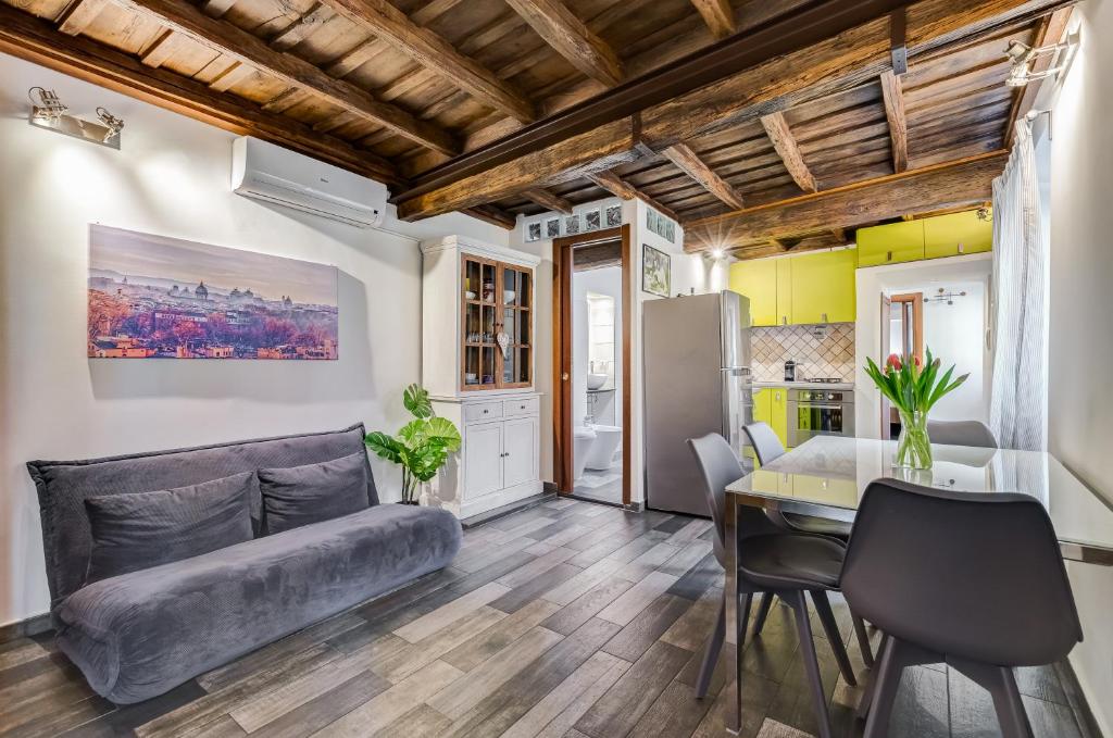 a living room with a couch and a table at Chiavari Apartment in Rome