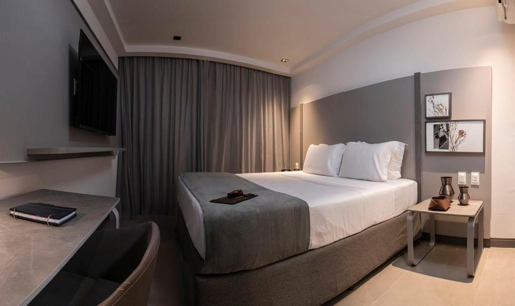 Cama ou camas em um quarto em HCM - Hotel Corais de Manaira