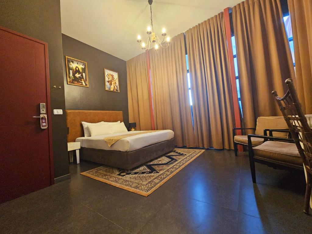 Postel nebo postele na pokoji v ubytování INTA Hotel